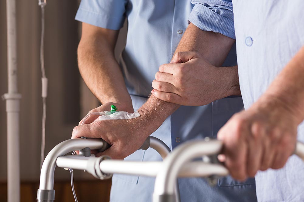 An image showing staff and patients working together