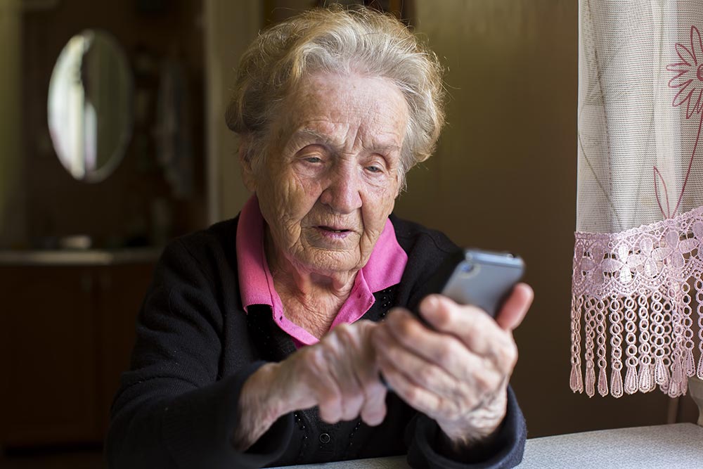 An image showing an older person using digital technology